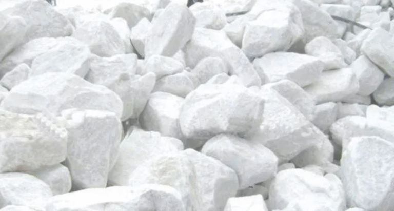 Bulk industrial dolomite (CaMg(CO₃)₂) stored in a warehouse, ready for steel production, construction materials, and chemical applications